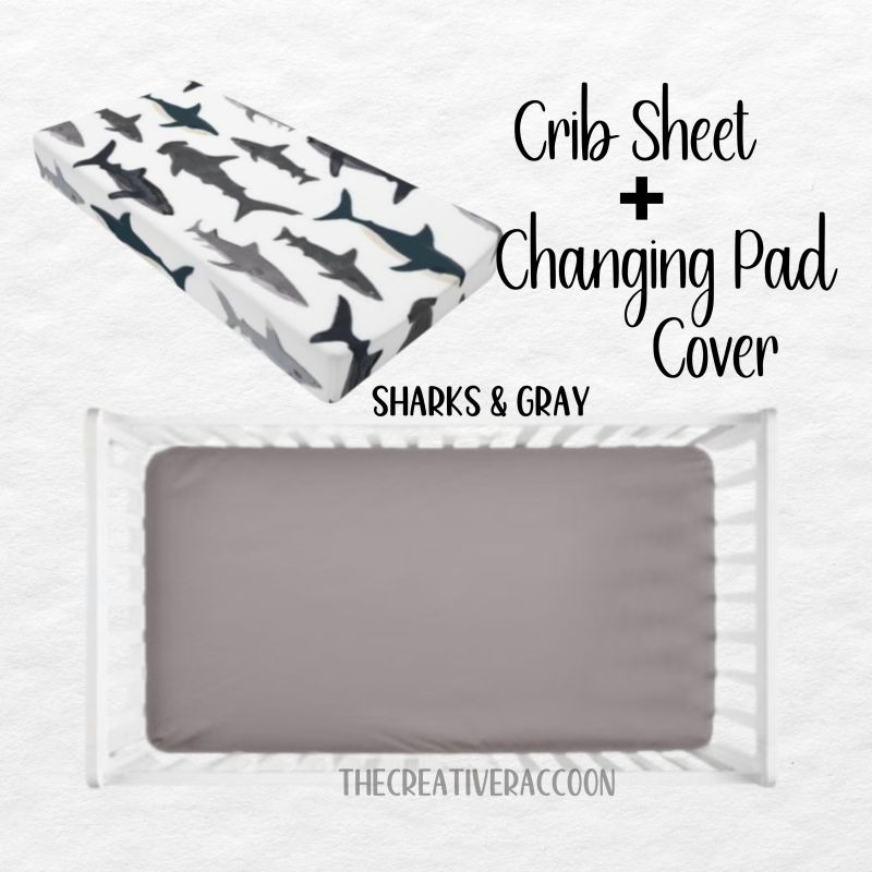 Gray Crib sheet and changing pad cover set with shark pattern on a white background.
Nautical Bedding Shark Theme Crib Bedding Blue Nursery - The Creative Raccoon