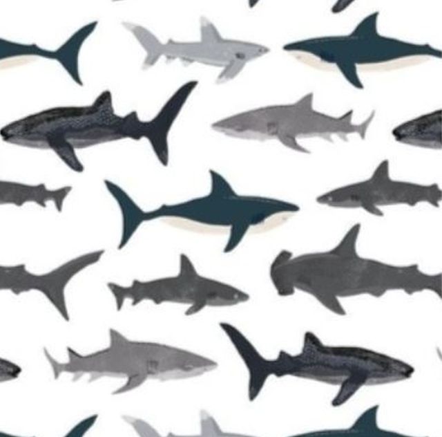 Pattern of sharks in various colors on a white background
Shark Baby Blanket, Nautical Themed Nursery - The Creative Raccoon