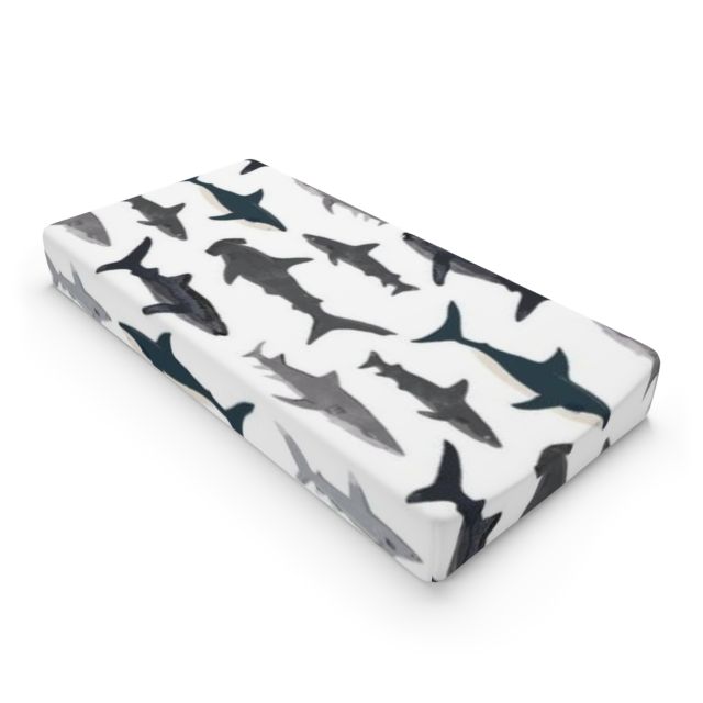 White changing table with shark-patterned cover against a wall with teddy bear decorations
Shark Changing Pad Cover - The Creative Raccoon
