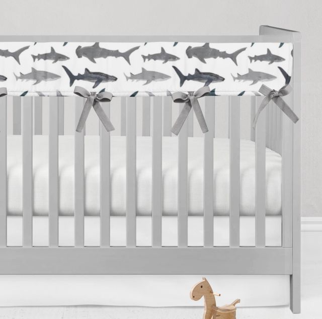 Crib with shark-patterned rail cover and gray bows on a white background
Shark Rail Cover, Nautical Themed Nursery - The Creative Raccoon