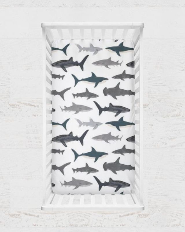 Baby crib sheet with shark pattern on a white background
Shark Theme Crib Sheets & Changing Pad Cover - The Creative Raccoon