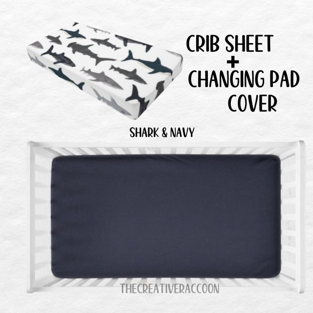 Navy Crib sheet and changing pad cover set with shark pattern on a white background.
Shark Theme Crib Sheets & Changing Pad Cover - The Creative Raccoon