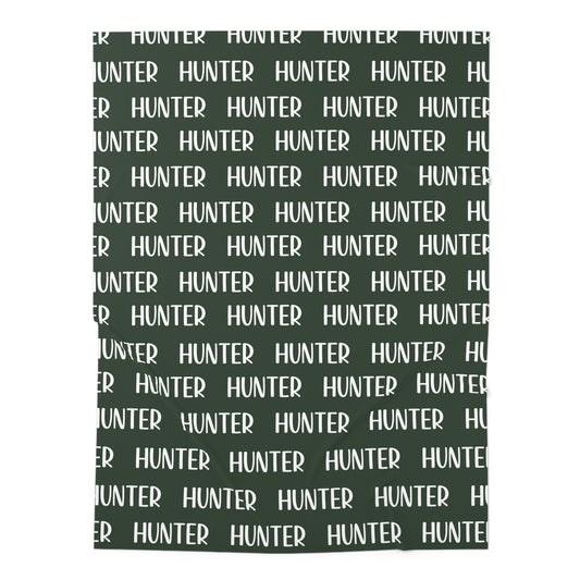 hunter green swaddle blanket with custom name. Name shown in white.