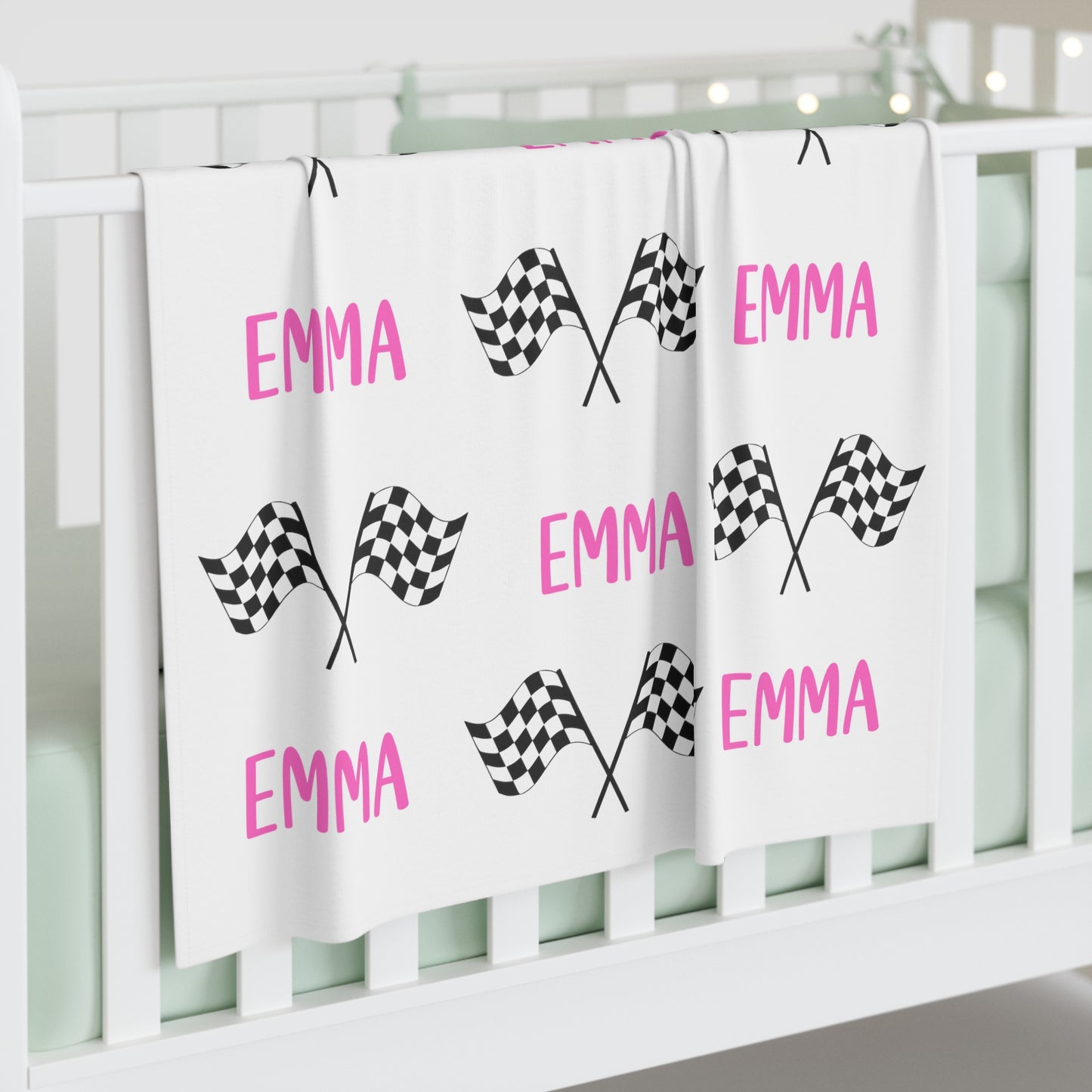 racing chekered flag with name swaddle blanket. Name shown in pink. 