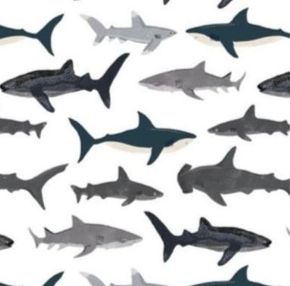 Pattern of sharks in various colors on a white background
Baby Blanket Shark Themed - The Creative Raccoon