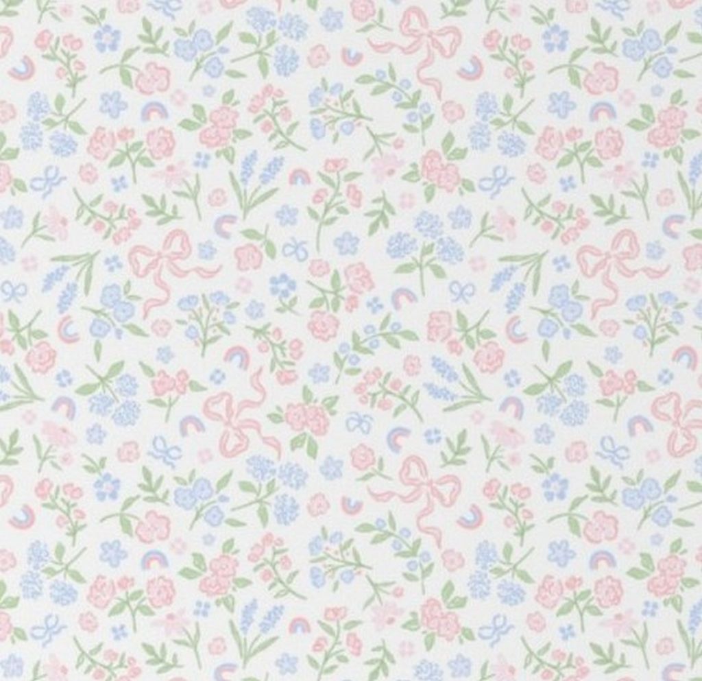 Pastel floral and bow pattern on a white background. Bow & Floral Crib Sheet - The Creative Raccoon
