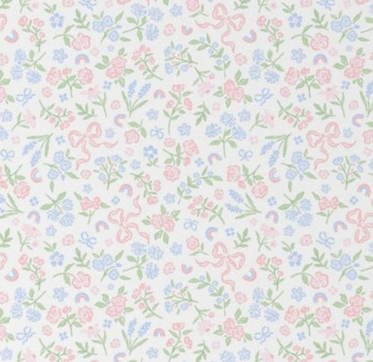 Pastel floral and bow pattern on a white background. Bow & Floral Crib Sheet - The Creative Raccoon
