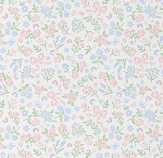 Pastel floral and bow pattern on a white background. Bow & Floral Crib Sheet - The Creative Raccoon