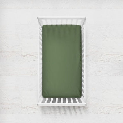 Green fitted sheet on a white crib with a light gray background
Crib Sheet: Dark Sage Gingham - The Creative Raccoon