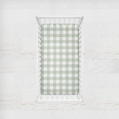 Two crib sheets, one sage gingham plaid and one solid sage. Crib Sheet: Light Sage Gingham - The Creative Raccoon 