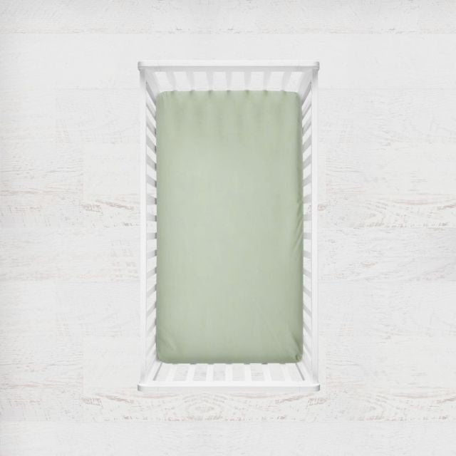 Two crib sheets, one sage gingham plaid and one solid sage. Crib Sheet: Light Sage Gingham - The Creative Raccoon 