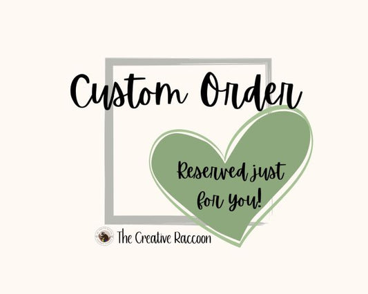 Green heart with text 'Custom Order Reserved just for you!' on a white background. The Creative Raccoon 
