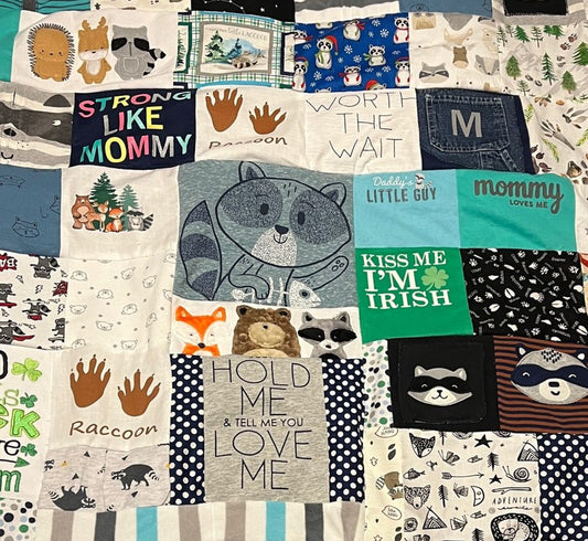 Raccoon themed quilt made from baby & children's clothes. The couple purchased the clothes when they were doing IVF. Their IVF & pregnancy weren't successful, and they wanted a keepsake created with their baby's clothes. 