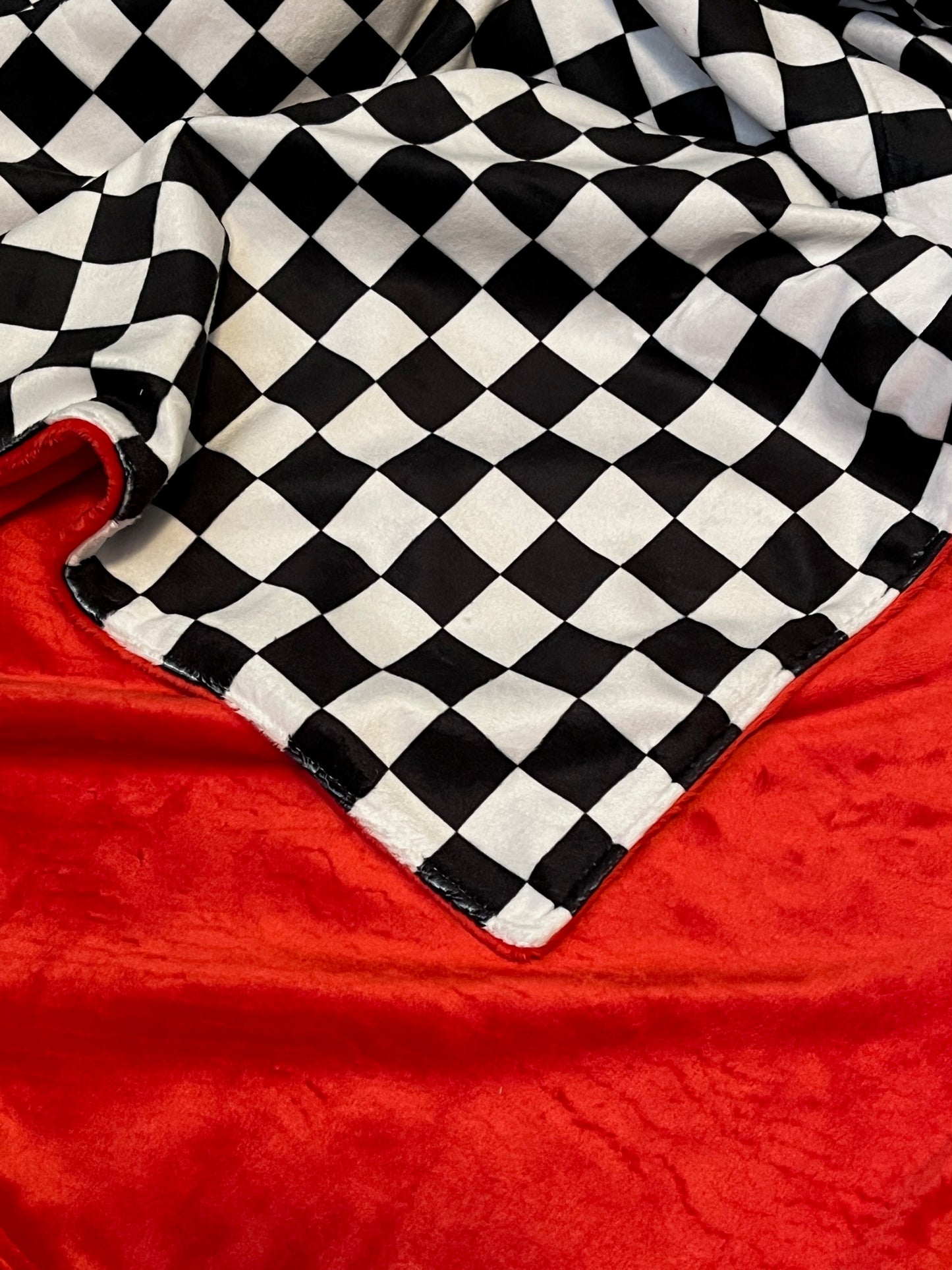 black and white racing check blanket, shown with minky top and red minky back