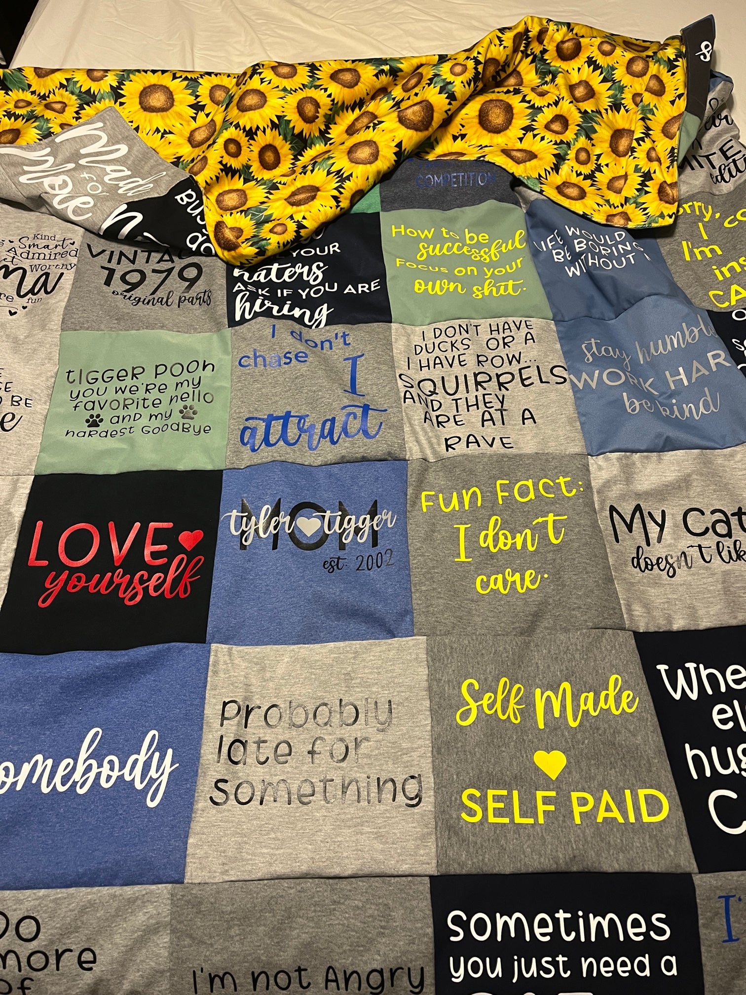 custom t shirt quilt with sunflower minky back. Sunflower minky back is extra and has limited quantities available.             