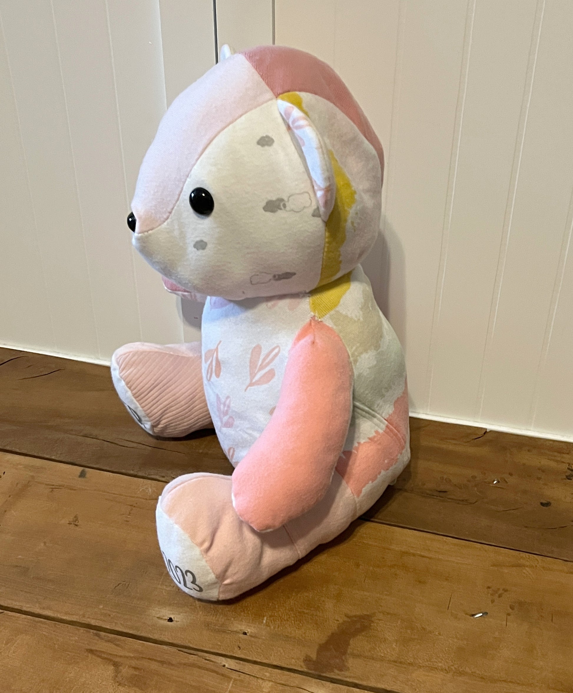pink & coral bear shown from the side