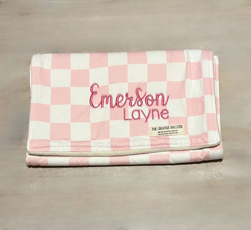 Pink and white checkered burp cloth with 'Emerson Layne' embroidery on a wooden surface
Pink Checkered Baby Bib and Burp Cloth Personalized