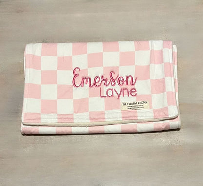 Pink and white checkered burp cloth with 'Emerson Layne' embroidery on a wooden surface
Pink Checkered Baby Bib and Burp Cloth Personalized