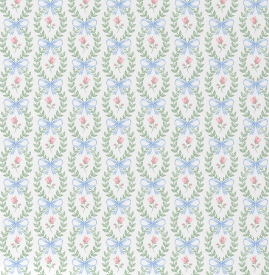 Pattern of blue bows and pink flowers on a light green background.
Pink Rose & Blue Bow Crib Sheet - The Creative Raccoon