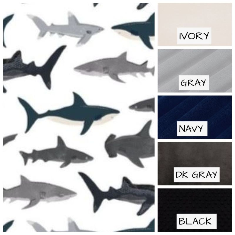Pattern of sharks with color swatches labeled 'Ivory', 'Gray', 'Navy', 'DK Gray', and 'Black'.
Shark Baby Blanket, Nautical Themed Nursery - The Creative Raccoon