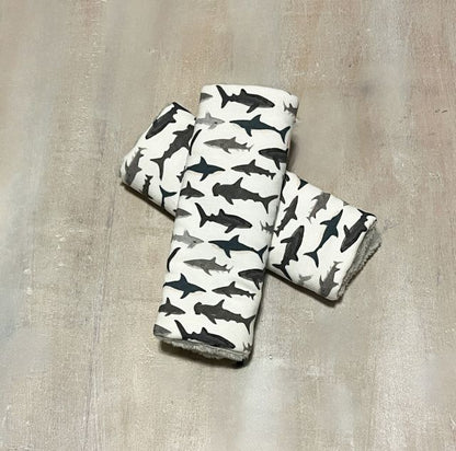 Shark Car Seat Strap Covers shown with gray minky back. 
Shark Car Seat Strap Covers Nautical Nursery - The Creative Raccoon