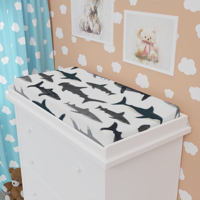 White changing table with shark-patterned cover against a wall with teddy bear decorations
Shark Changing Pad Cover - The Creative Raccoon