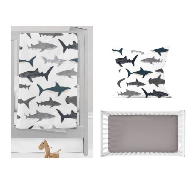 Shark blanket, throw pillow and gray crib sheet. Shark Nursery Starter Crib Bedding Set - The Creative Raccoon