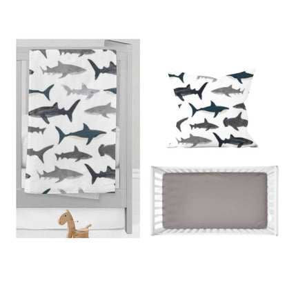 Shark blanket, throw pillow and gray crib sheet. Shark Nursery Starter Crib Bedding Set - The Creative Raccoon