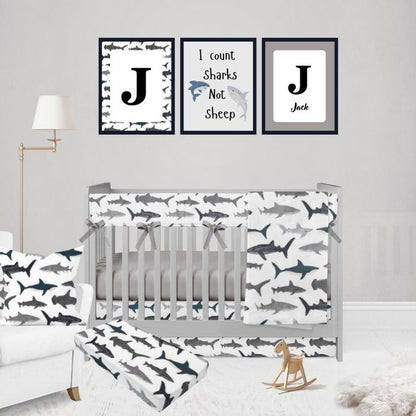 Nursery room with crib, shark-themed bedding, and wall art.
Shark Rail Cover, Nautical Themed Nursery - The Creative Raccoon