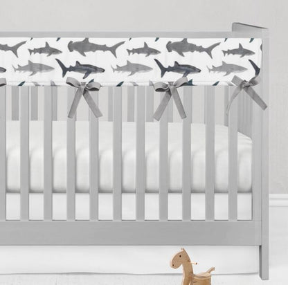 Crib with shark-patterned rail cover and gray bows on a white background
Shark Rail Cover, Nautical Themed Nursery - The Creative Raccoon