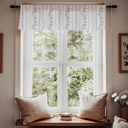Window with patterned fabric with green leaves and purple flowers on a white background for window valances and a wooden bench with pillows, featuring a view of greenery outside. Window Valance Stripes and Vines, Designer Floral - Pick Your Color - The Creative Raccoon 