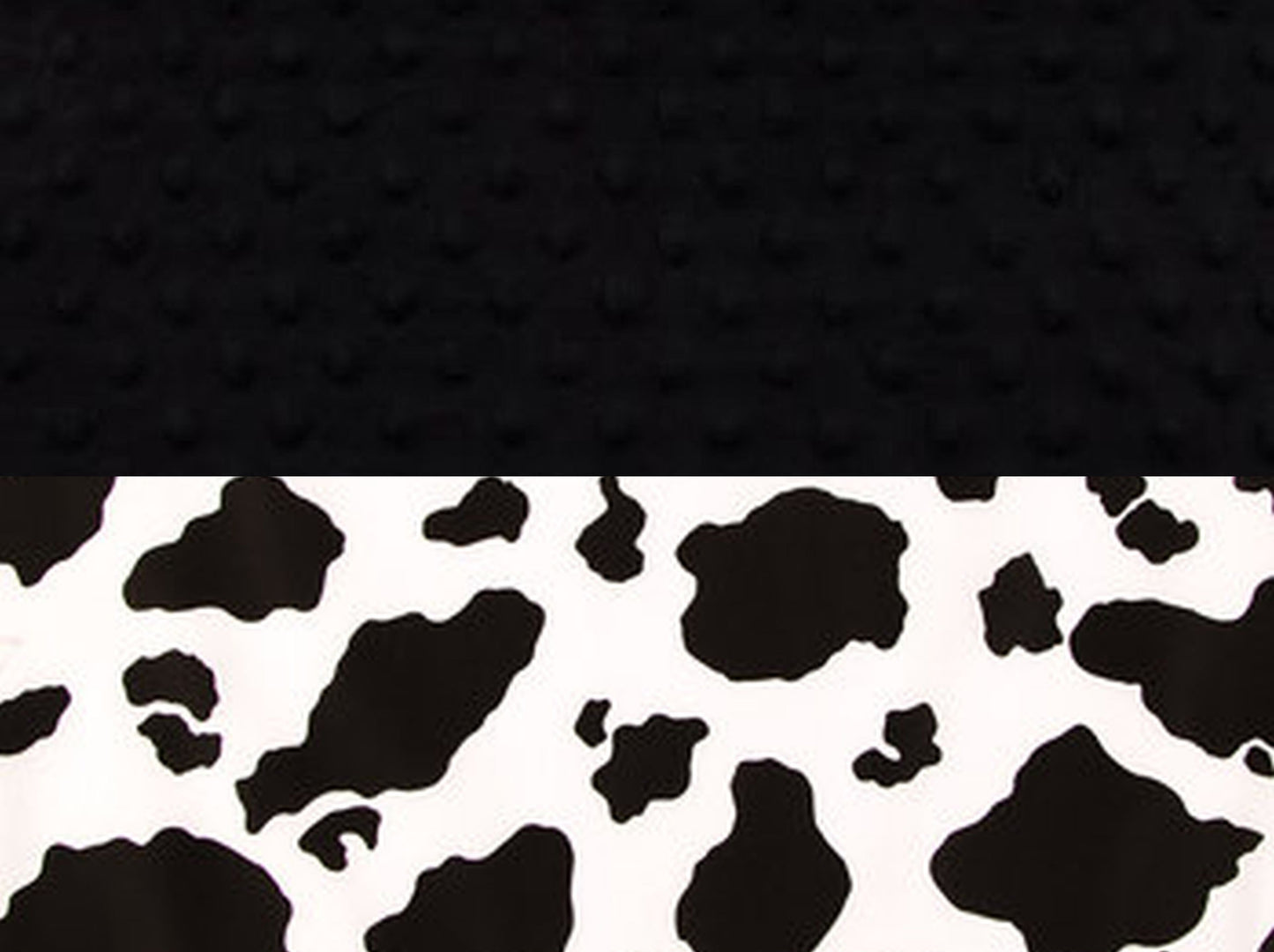 cow print blanket with black minky back. 