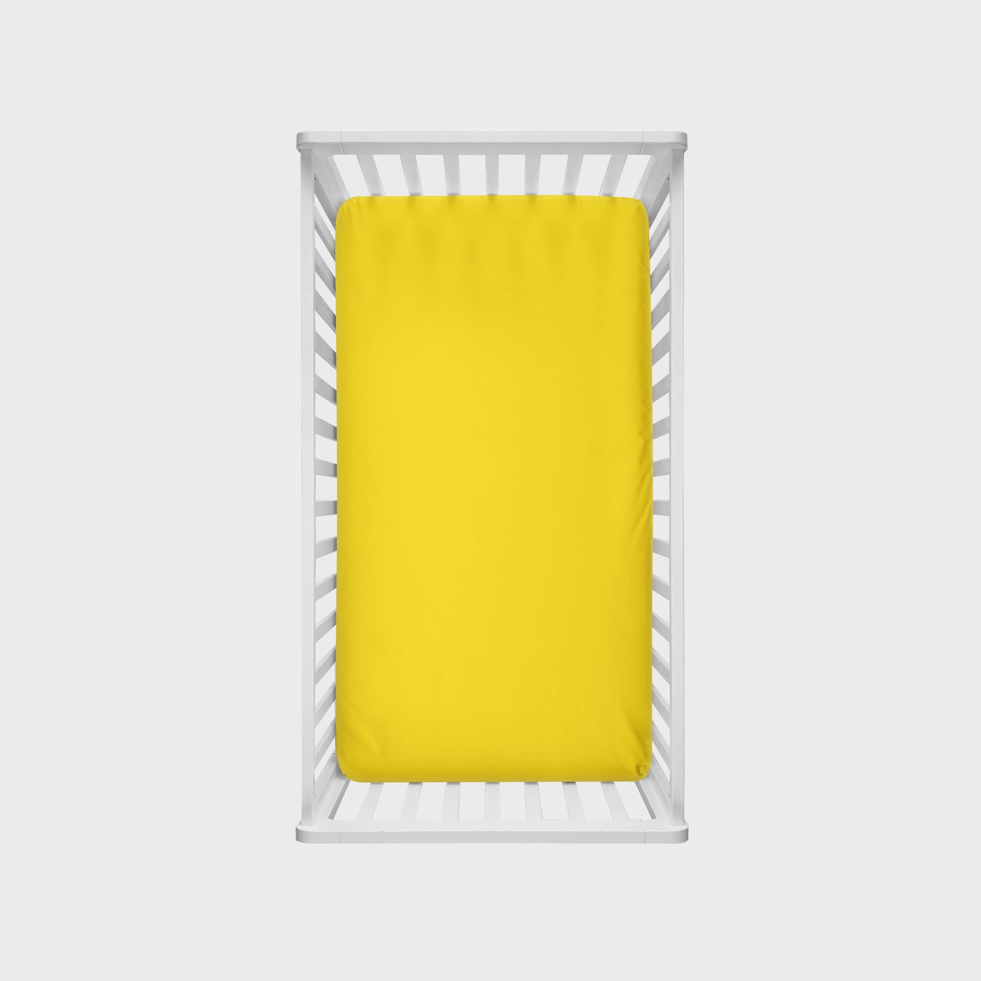 yellow crib sheet