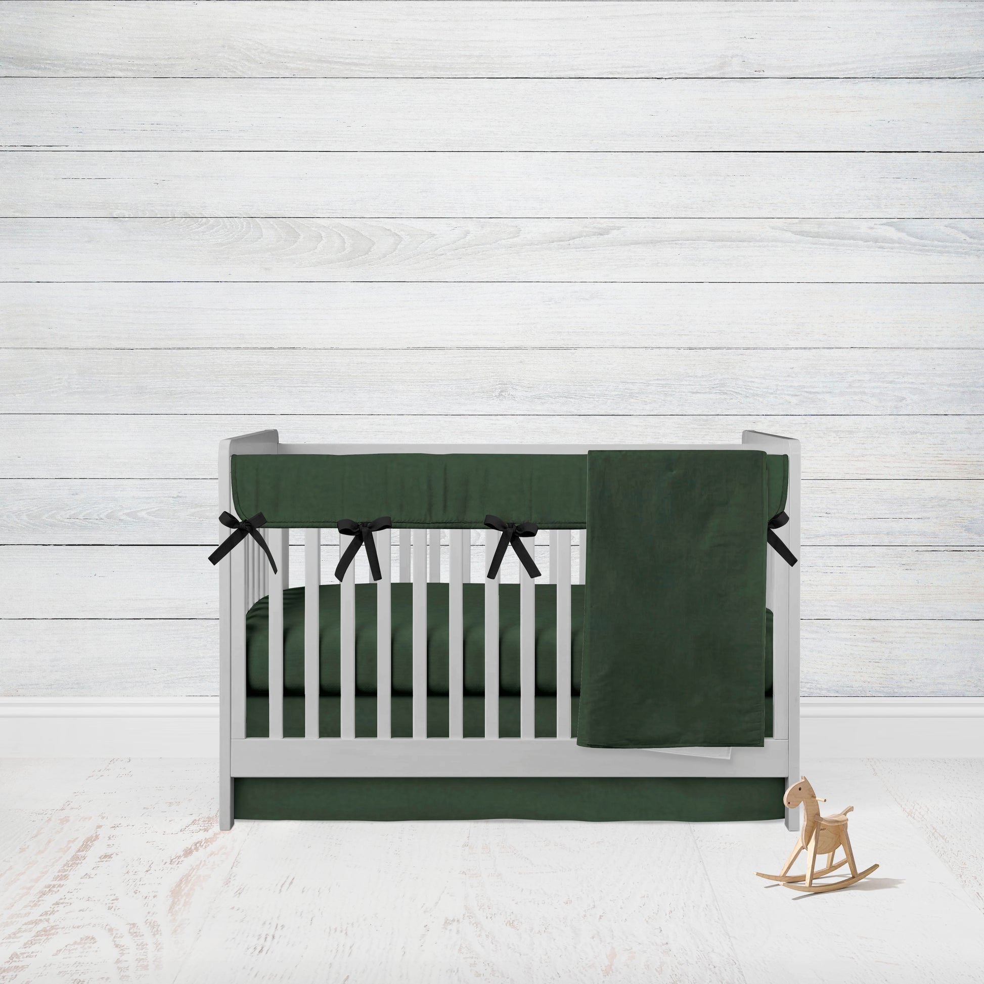 4-piece set includes hunter green crib rail cover, crib sheet, crib skirt and blanket. 5 piece set includes all items listed & changing pad cover