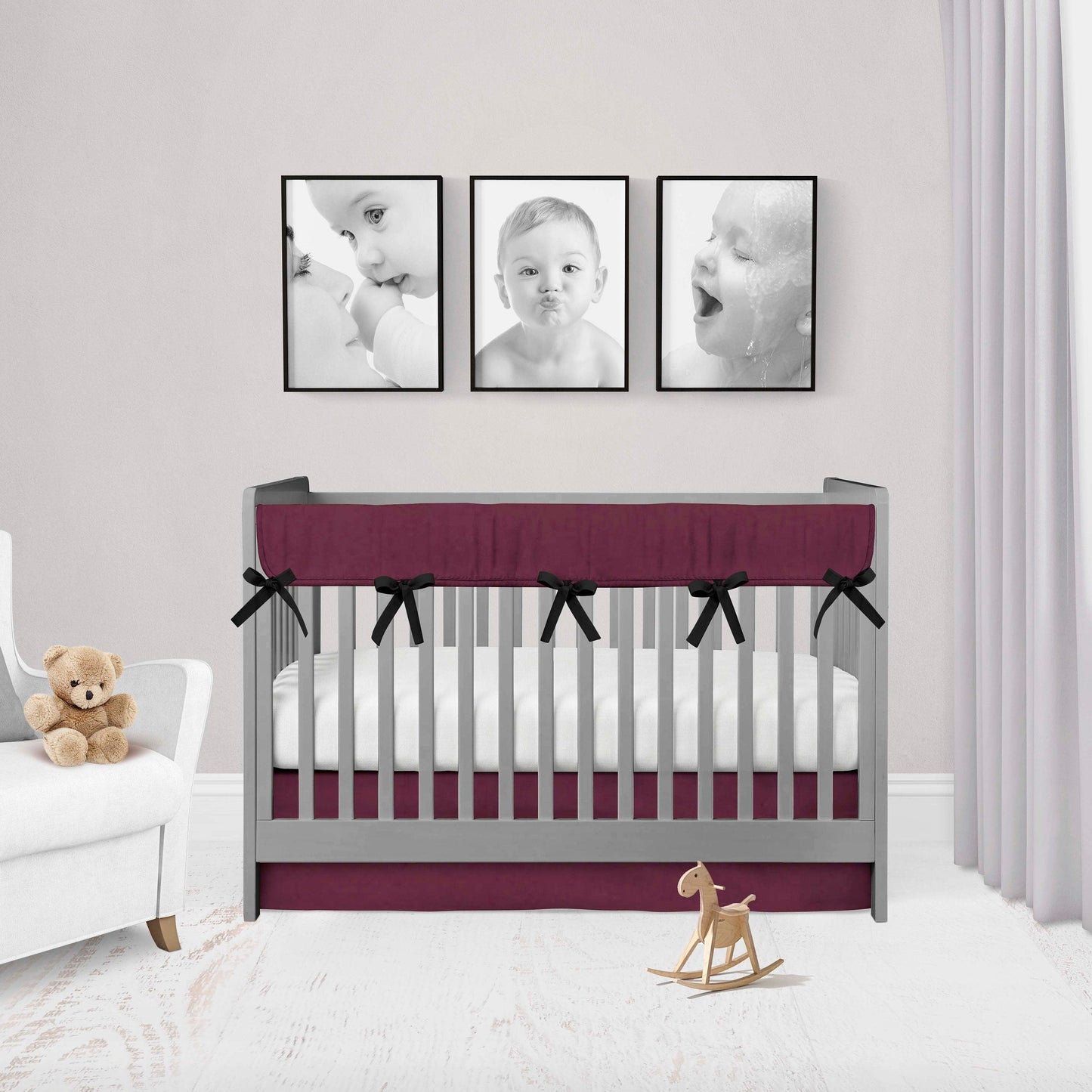 maroon rail cover with black ties & maroon crib skirt shown in the flat option
