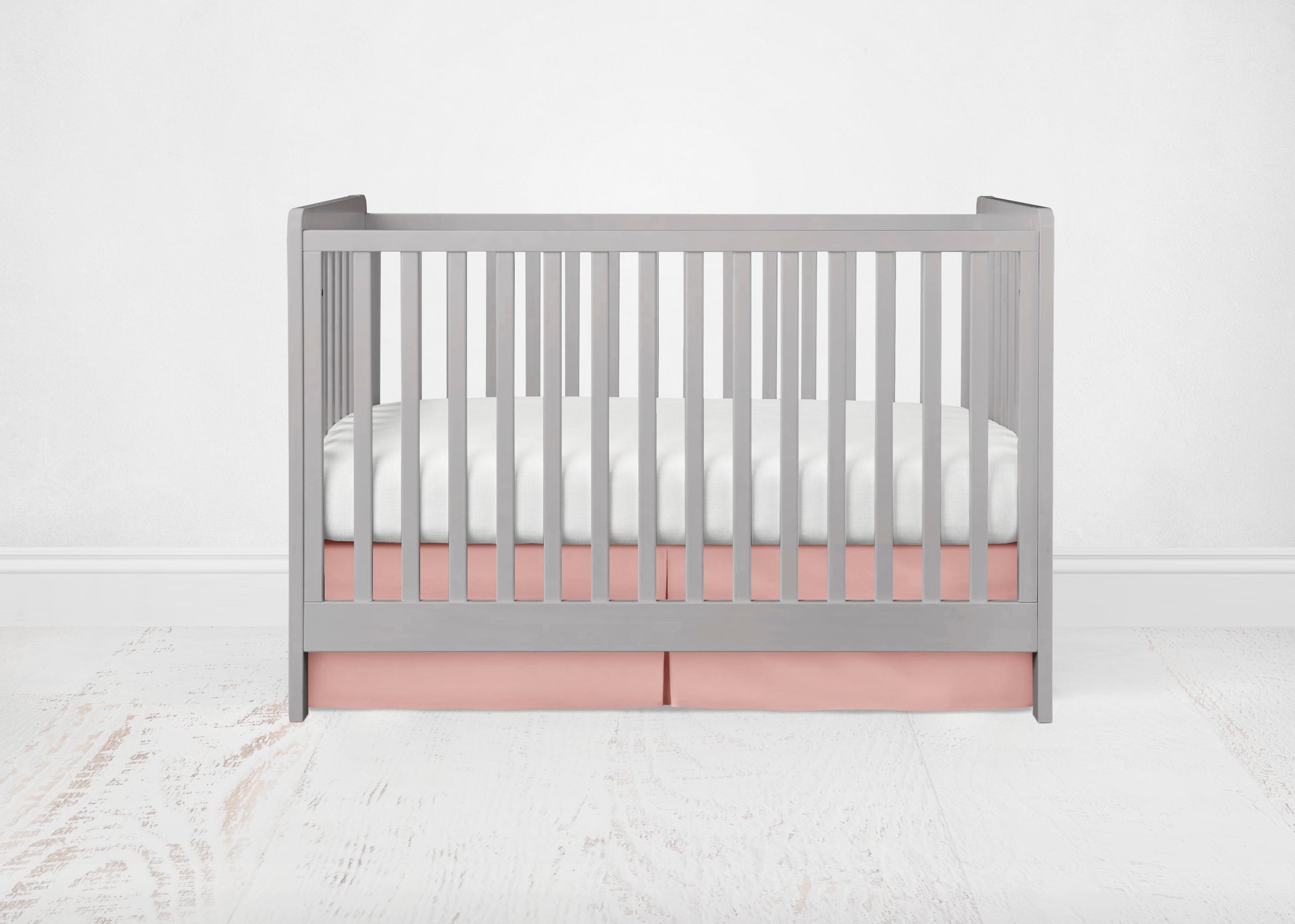 coral crib skirt shown in the pleated option