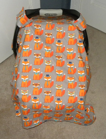 NERDY ORANGE FOX CAR SEAT CANOPY SHOWN WITH THE CLOSED OPTION