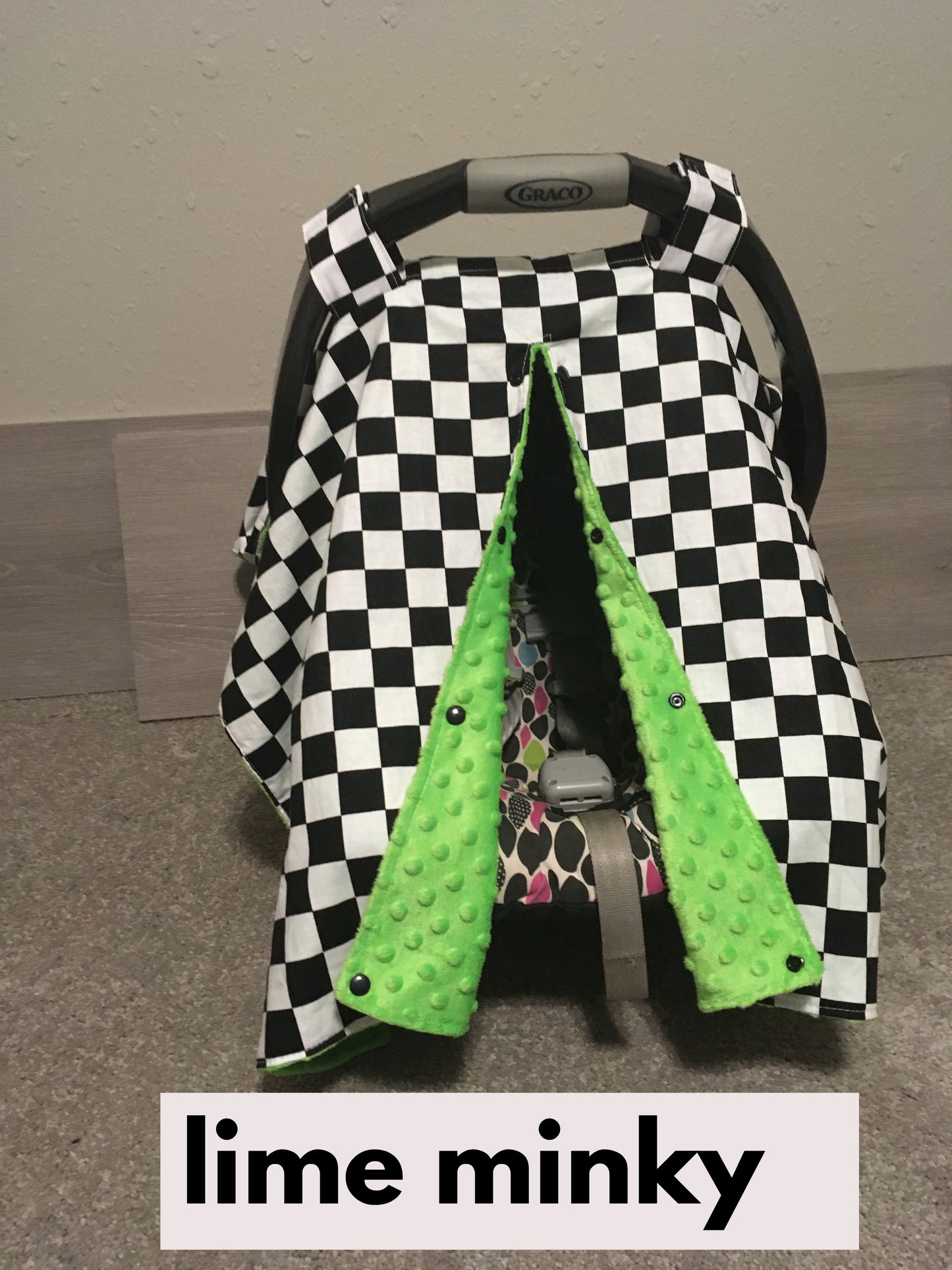 racing check car seat canopy shown in lime minky, in the open option