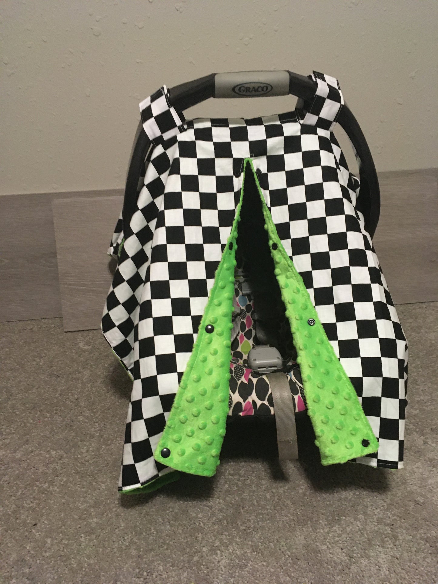 racing check car seat canopy shown in lime minky, in the open option