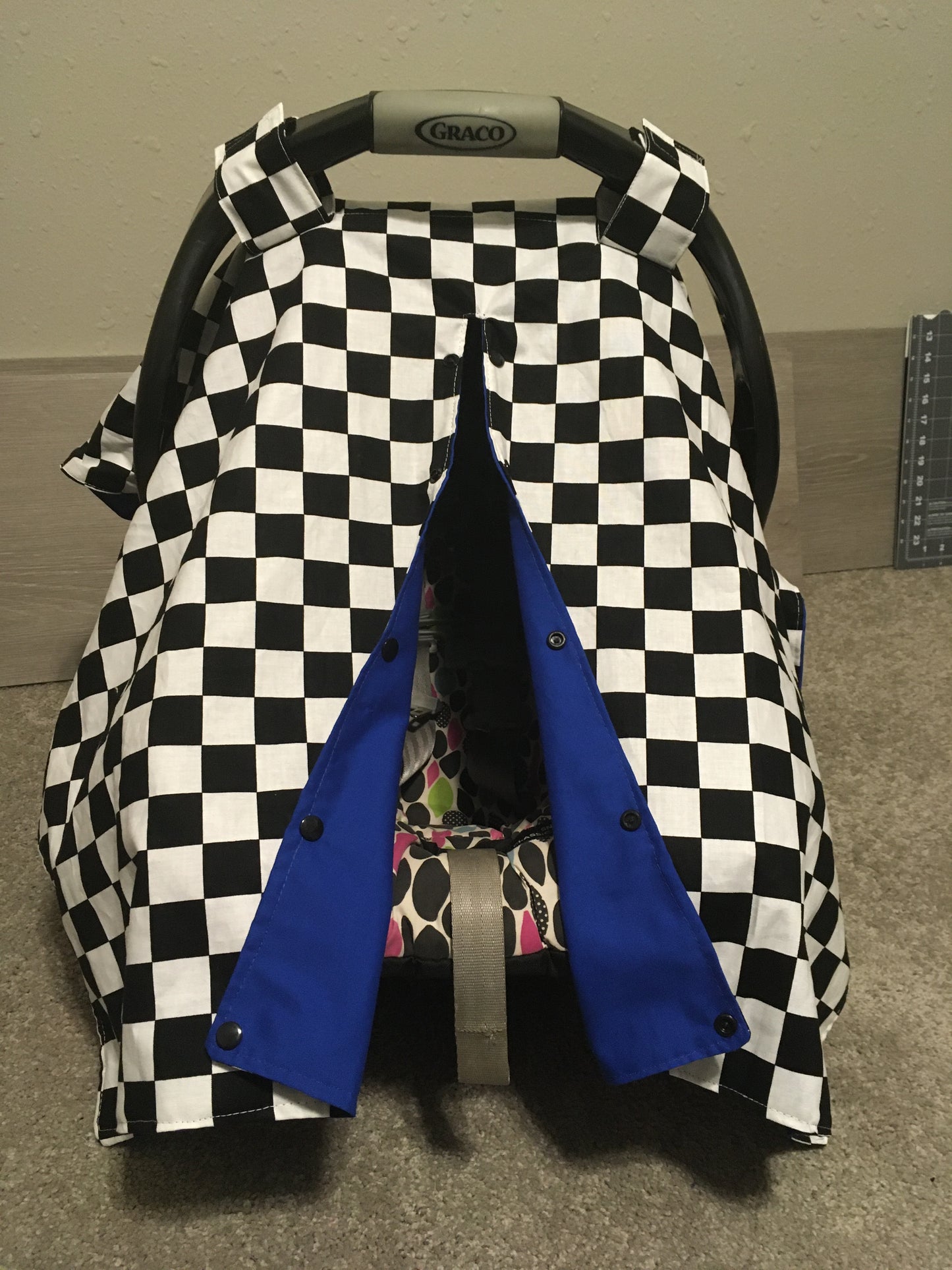 racing check canopy/car seat cover shown in royal blue cotton in the open option