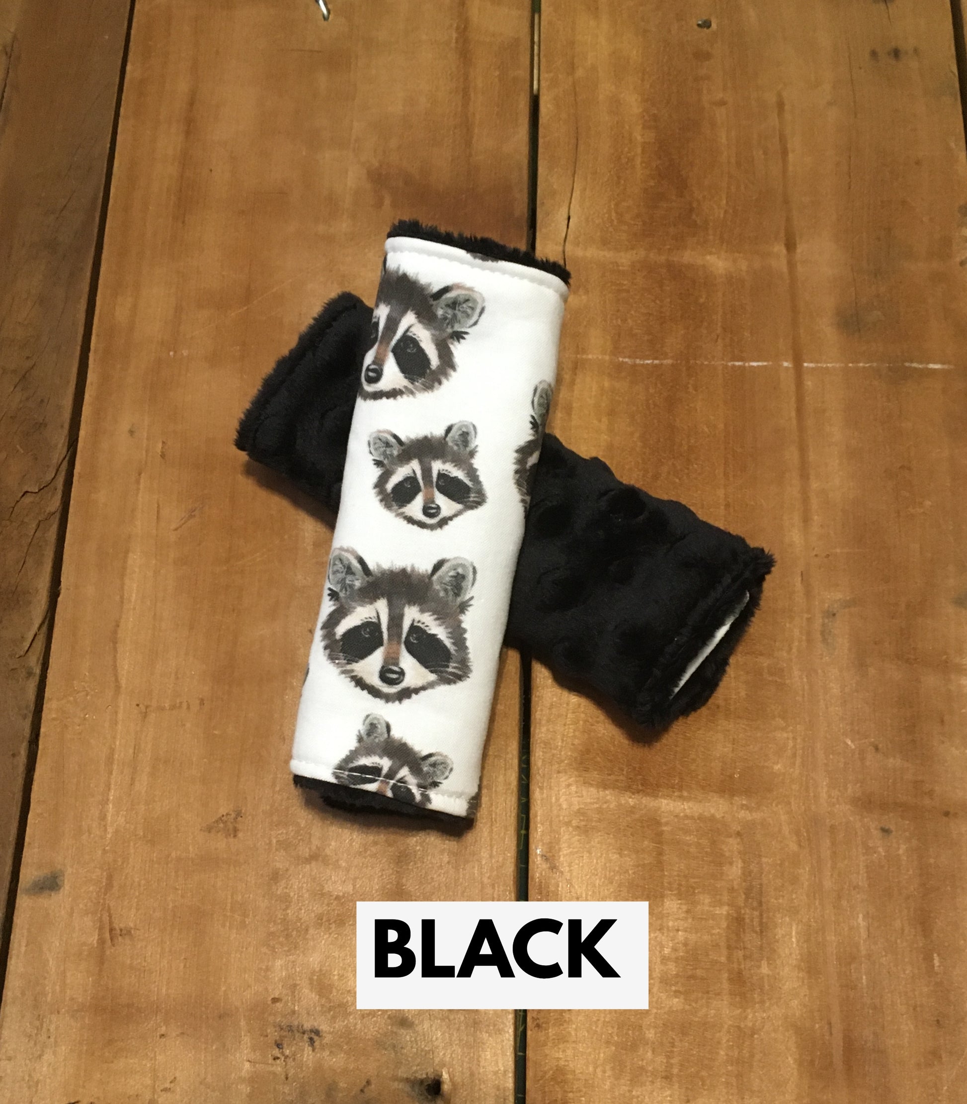 raccoon car seat strap covers shown in black