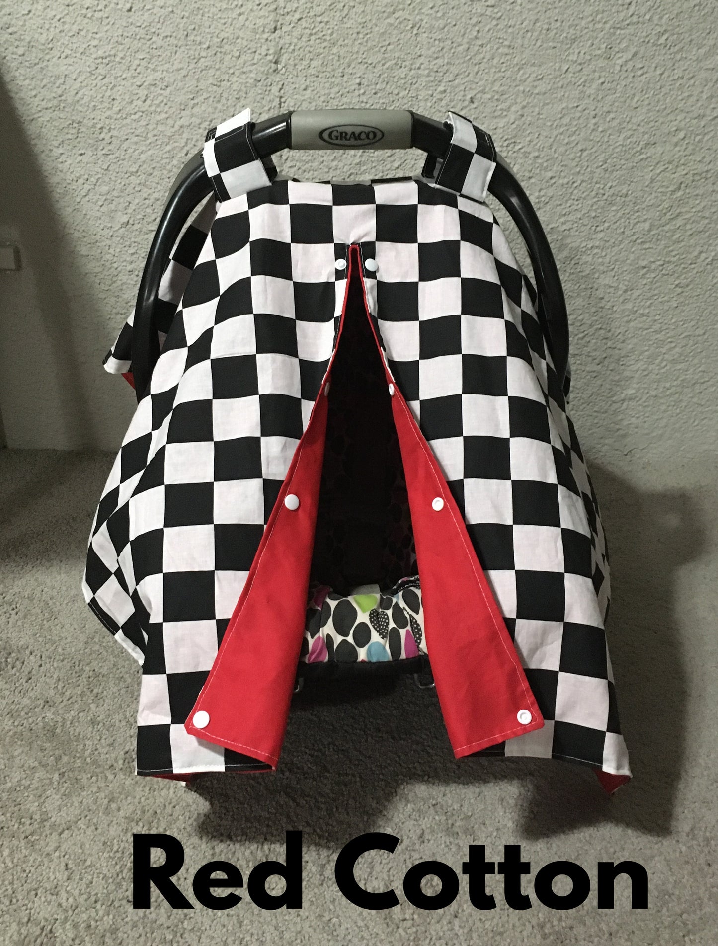 racing check canopy/car seat cover shown in red cotton in the open option