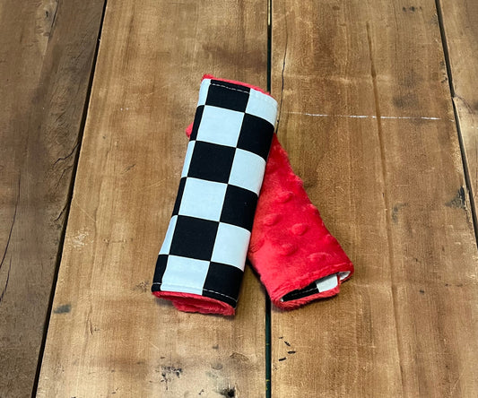 racing check car seat strap covers, shown in the 6" size and red minky back