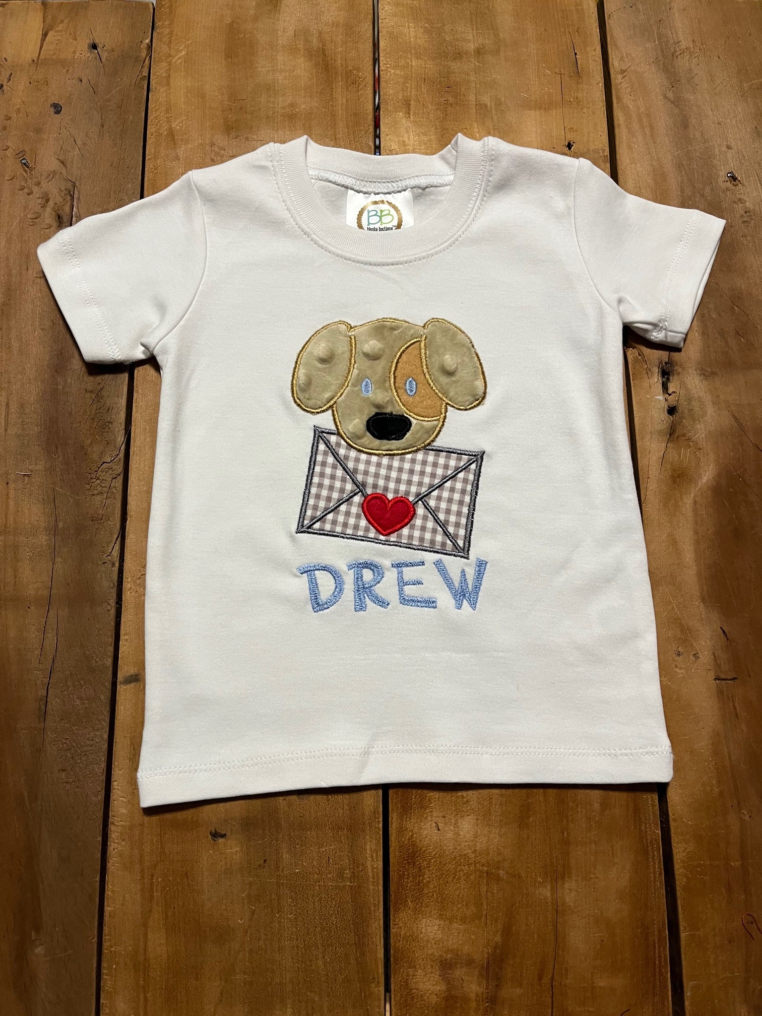 white shirt with puppy valentine's day applique design, name shown in "Charlie" font
