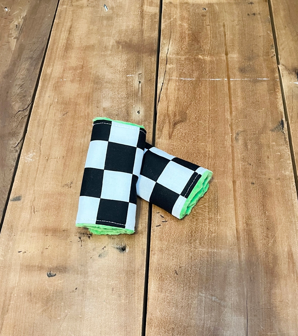 racing check car seat strap covers, shown in the 4" size and lime minky back