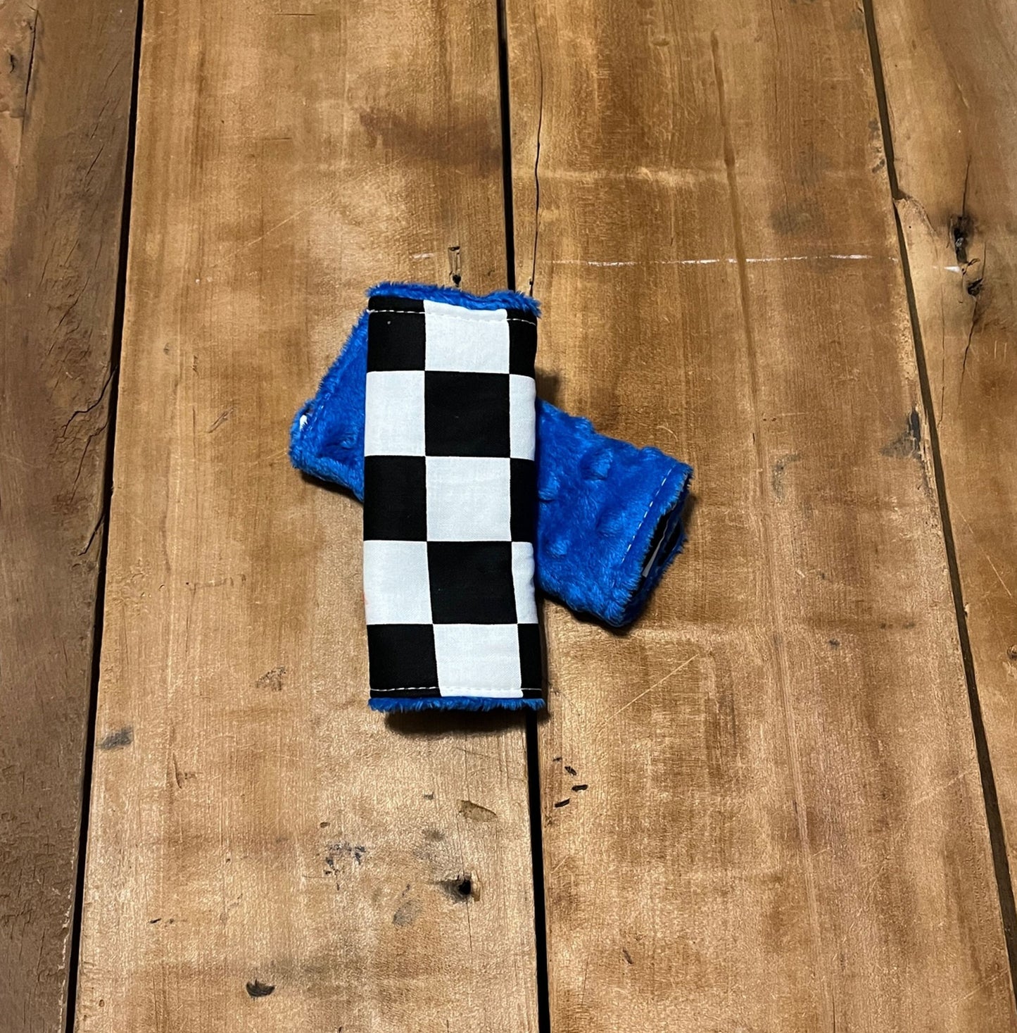 racing check car seat strap covers, shown in the 5" size and blue minky back