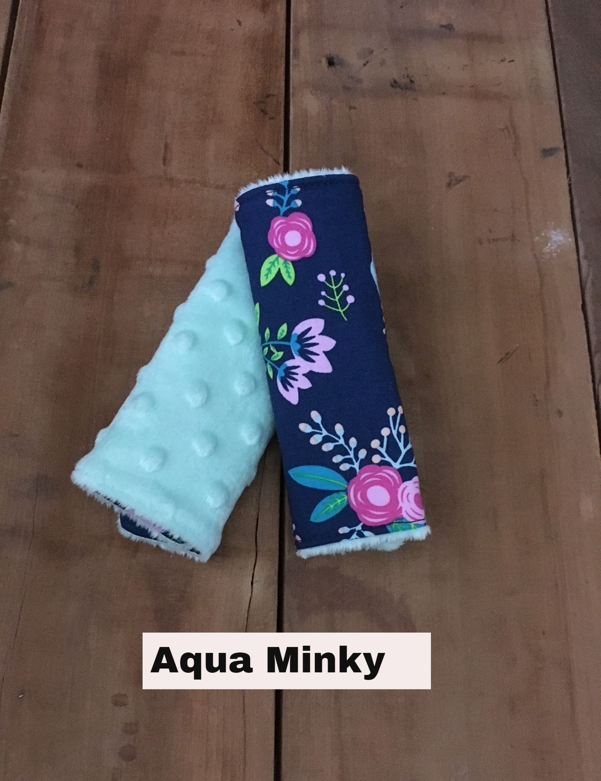 SET OF 2 navy floral car seat strap covers, shown with aqua minky