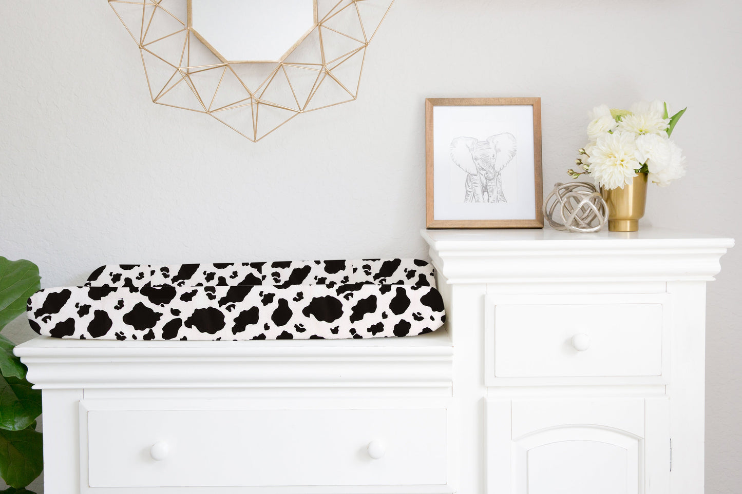 cow print changing pad cover available in 5-piece sets or upon request by itself.