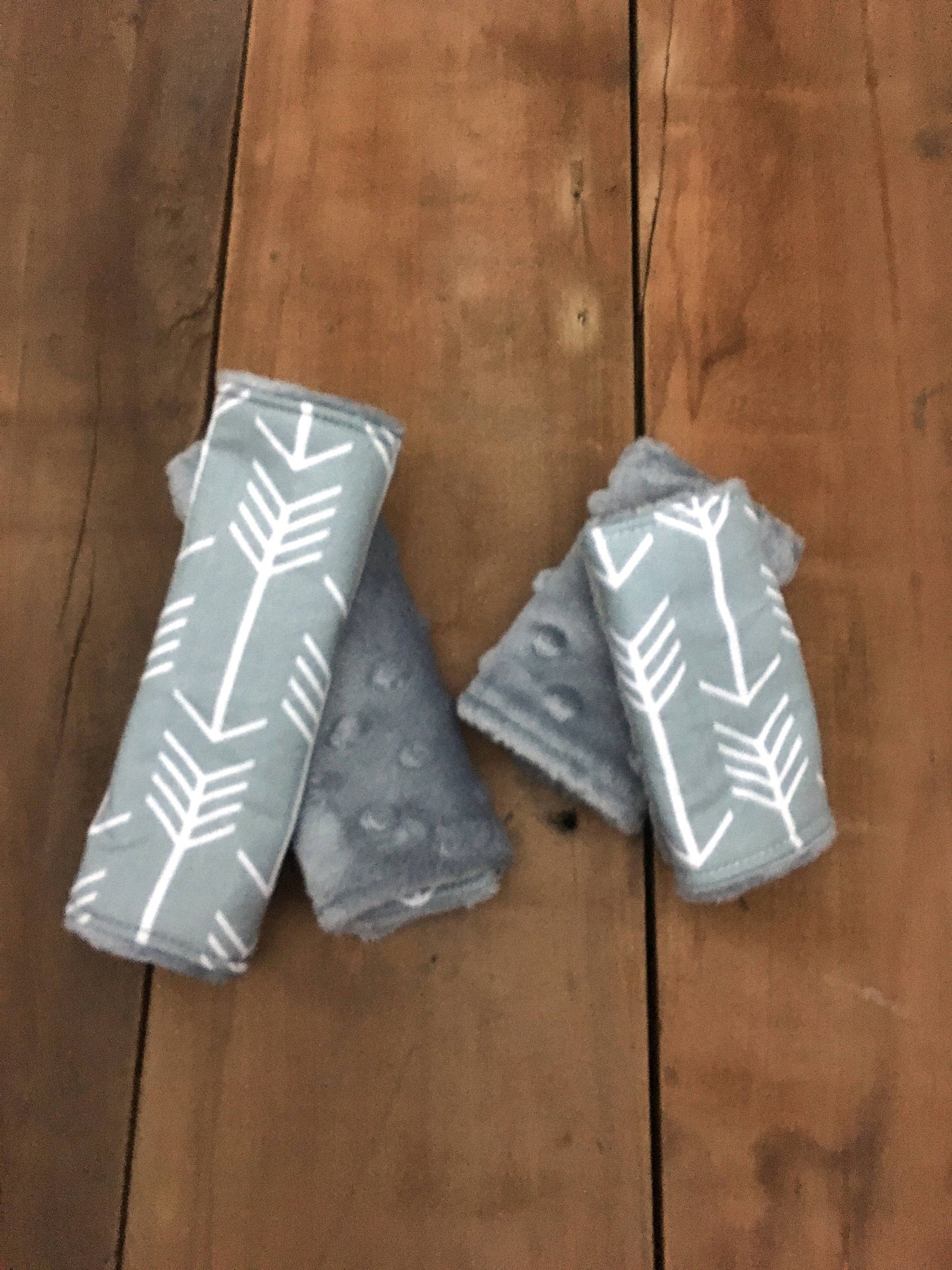 Gray arrow car seat strap covers shown in 6" & 4" size, shown with gray minky back