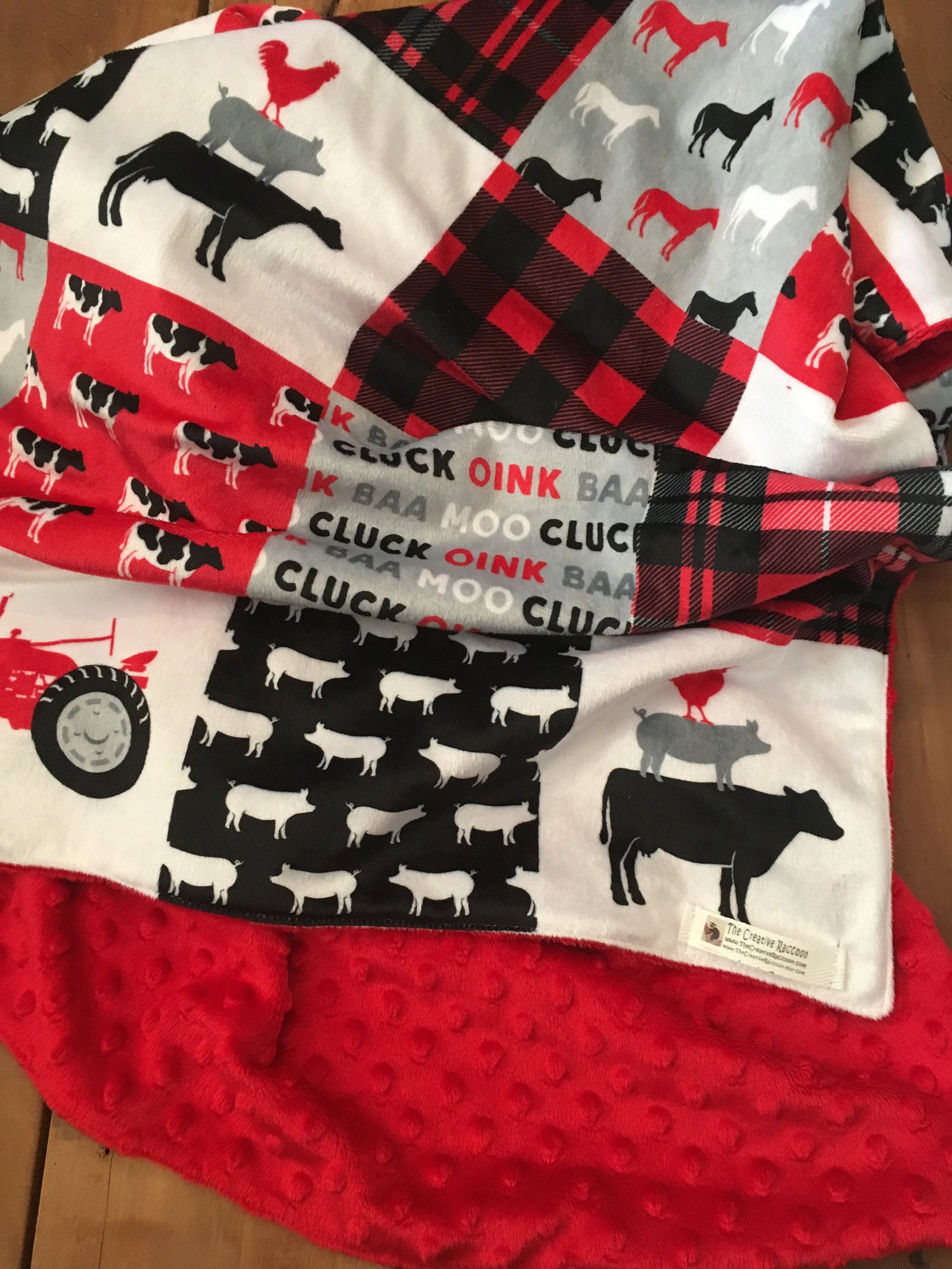 red tractor/farm minky blanket shown with red dot minky